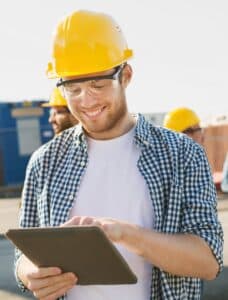 Construction worker using tablet on site