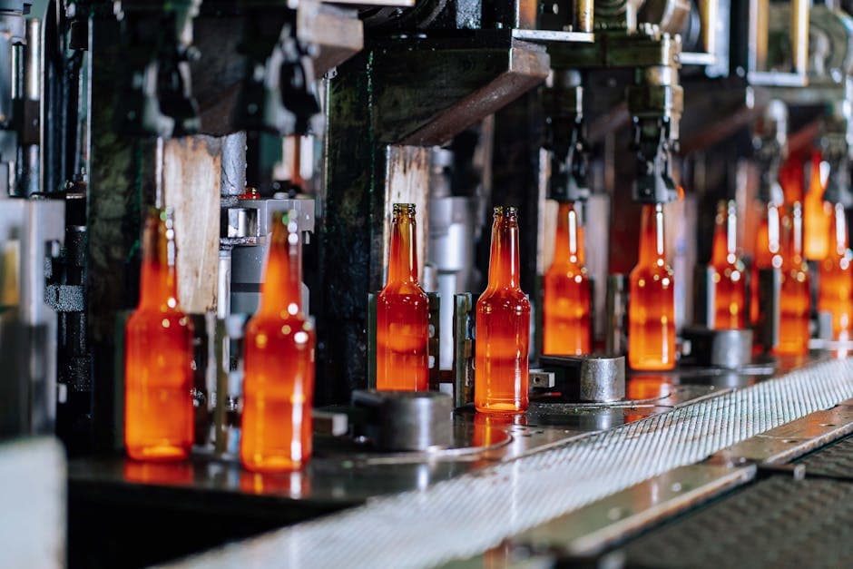 Glass bottle production line in a factory representing manufacturing output and order fulfillment