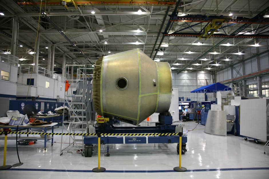 Carbon fiber composite layup and autoclave curing in aerospace manufacturing facility