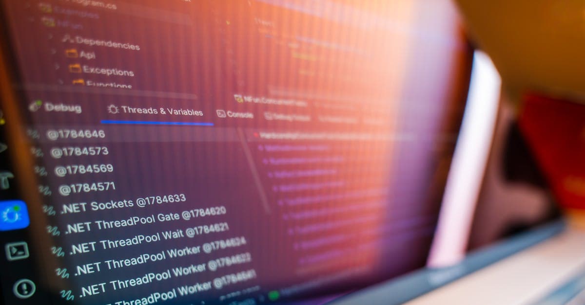 Manufacturing plant manager evaluating scheduling software on a factory floor workstation