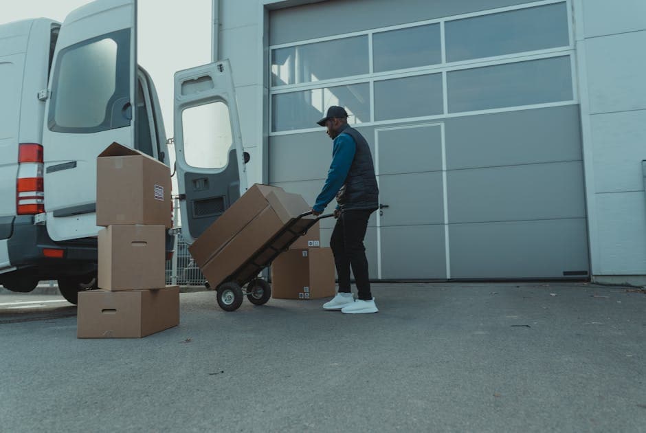 Delivery courier unloading packages from a van, representing on-time in-full delivery performance