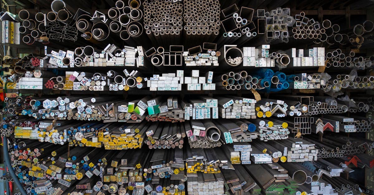 Purchasing manager reviewing MRP-generated purchase requisitions on a computer screen in a manufacturing office