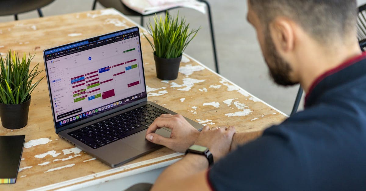 Manufacturing team evaluating production scheduling software options on a conference room screen